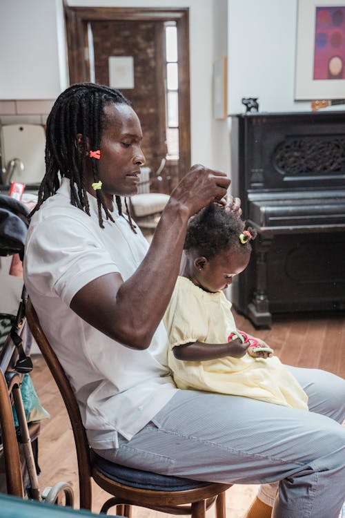 Free Father Doing His Baby Daughter Hair  Stock Photo