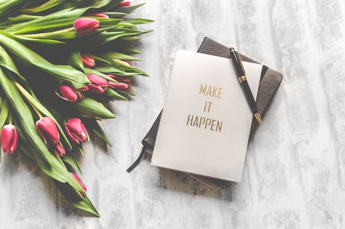 Free Make It Happen Book With Black Stylus Stock Photo