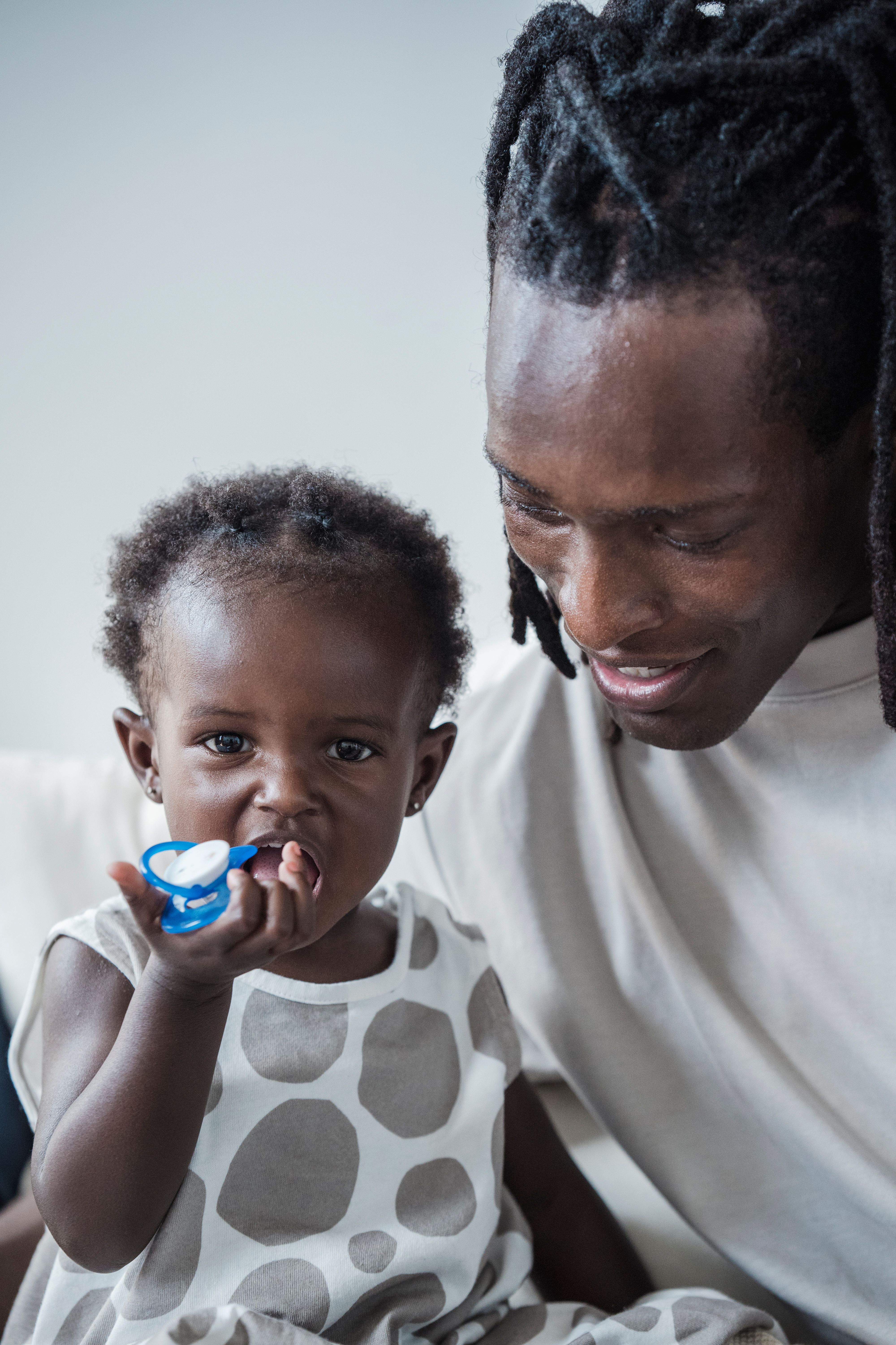 Father bonding with his baby daughter, highlighting love and family connection.