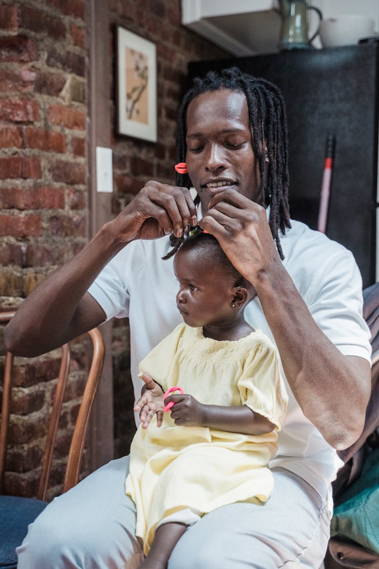 Father Dealing With Daughter Hair