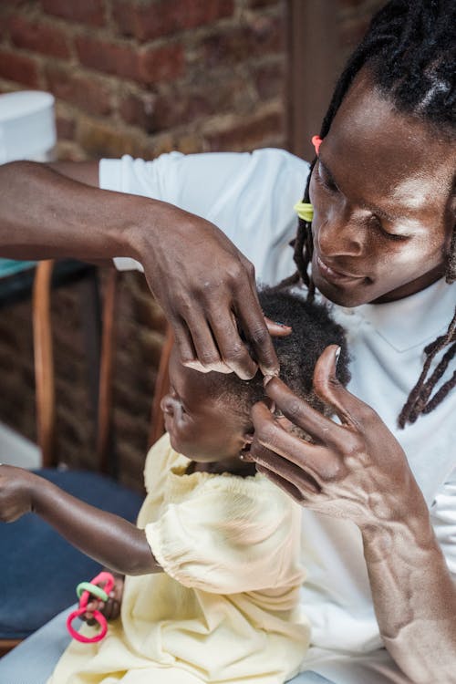 Father Taking Care of Daughter