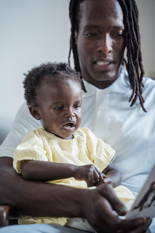 Free A Man Carrying a Child Stock Photo