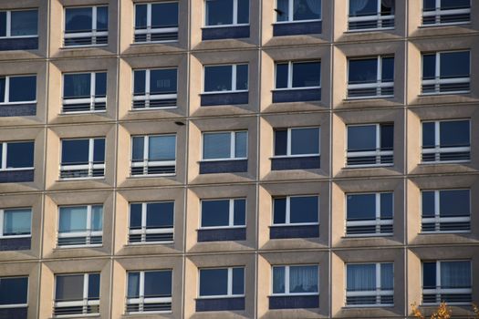 Close-up of a modern apartment building facade with glass windows in Berlin, Germany.