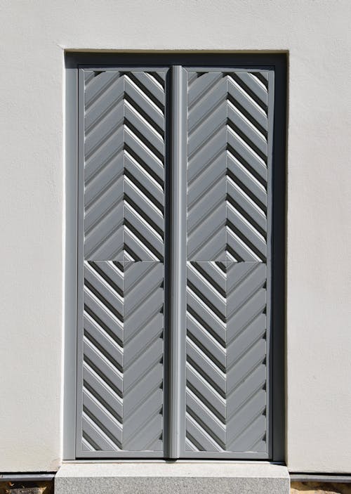 Free Aluminum Door on Gray Wall Stock Photo
