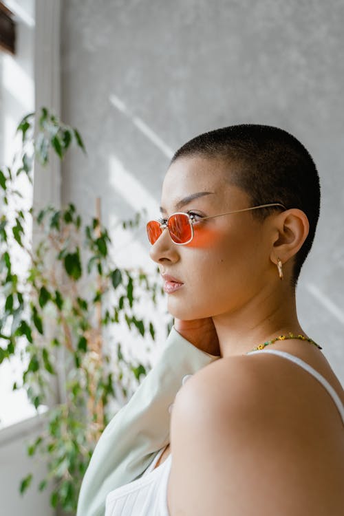 Free Photo of a Bald Woman Wearing Sunglasses Stock Photo