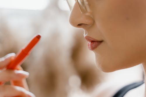 Woman Holding a Lipsticks