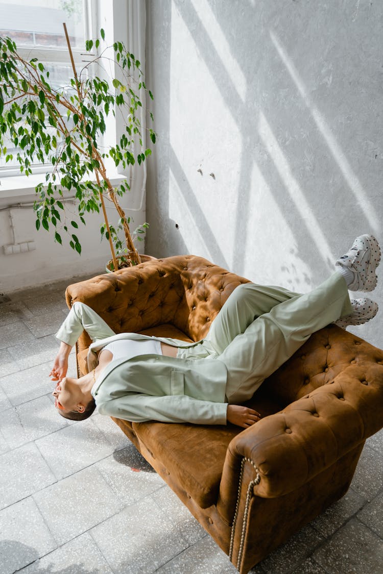 Woman Lying On A Couch