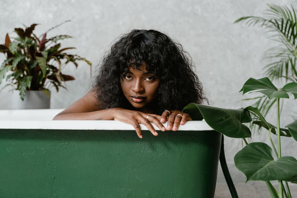 Woman relaxing in a bathtub