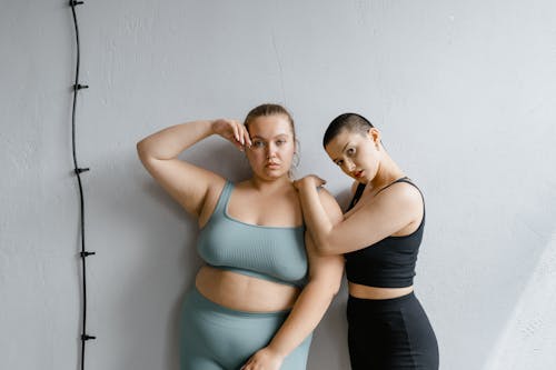 Free curvy Women Posing while Looking at Camera Stock Photo