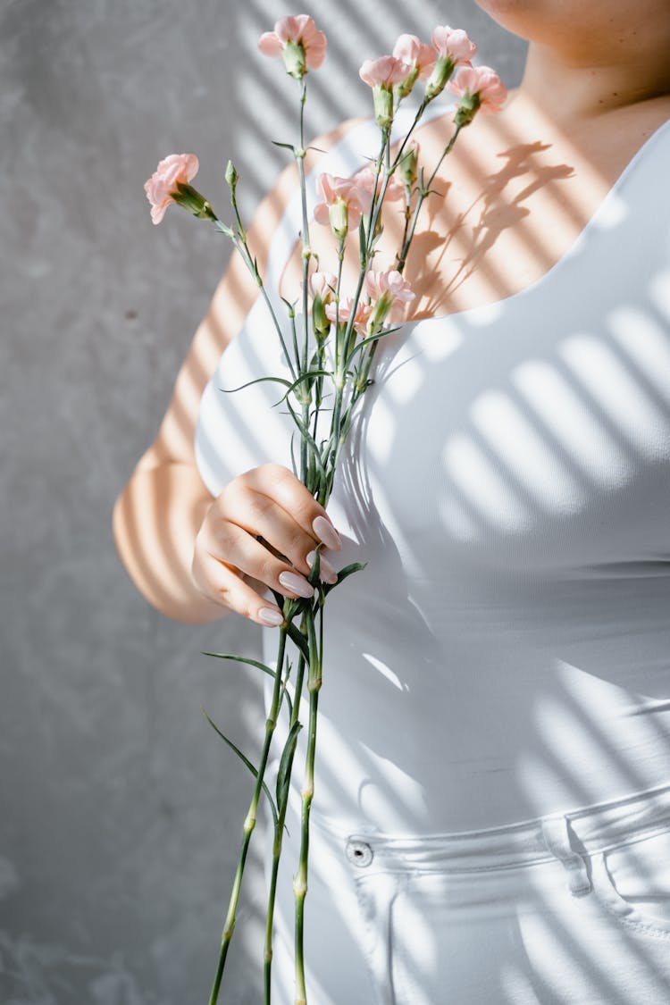 Person Holding Flowers