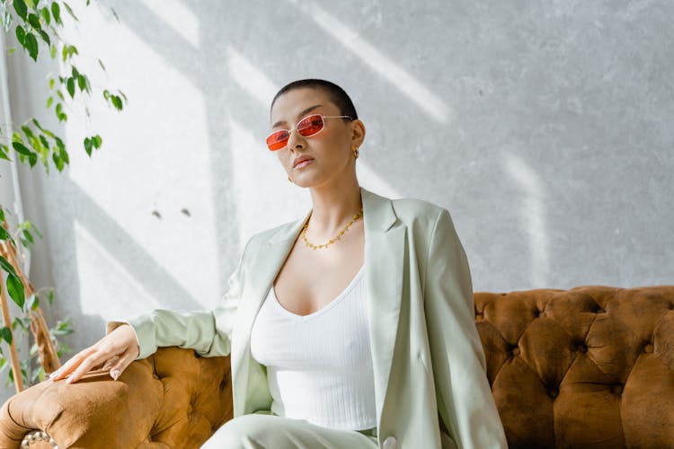 Woman Wearing A Blazer Sitting On A Couch