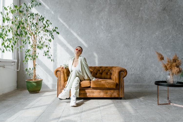 Woman Sitting On A Couch