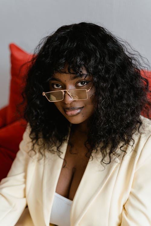 Smiling Curly Hair Woman With Eyeglasses 