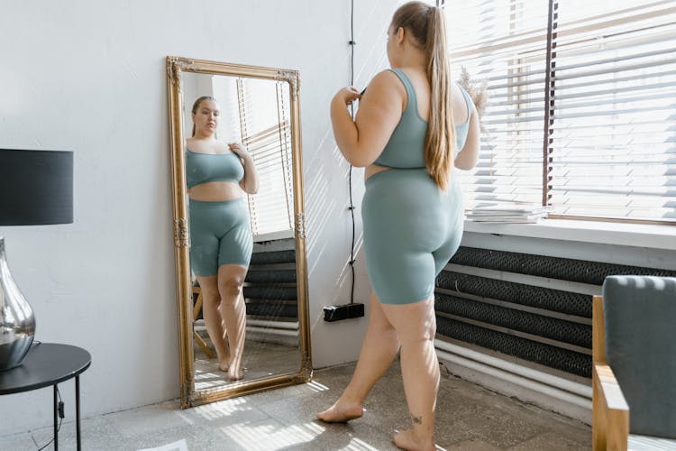 A Plus-Size Woman In Gray Tank Top