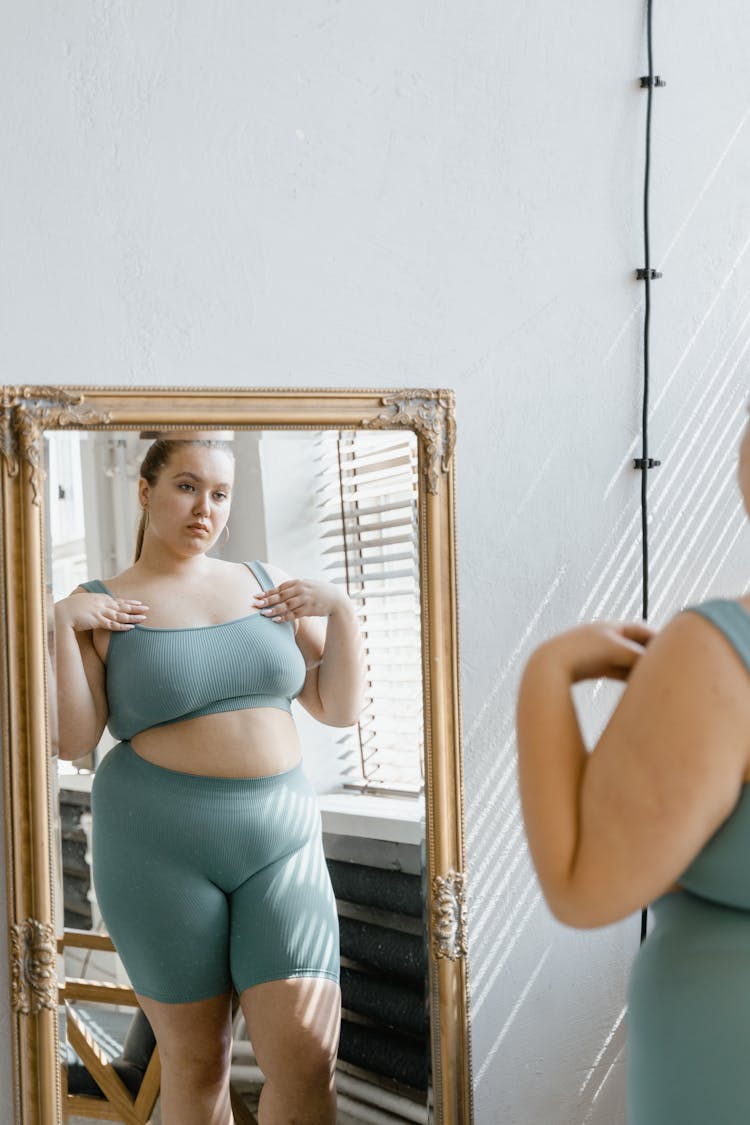 A Plus-Size Woman In Gray Tank Top