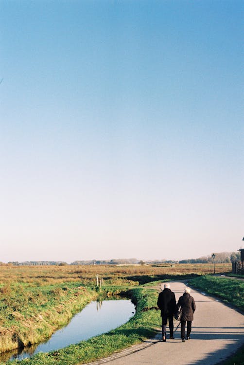 Couple Walking Down a Road