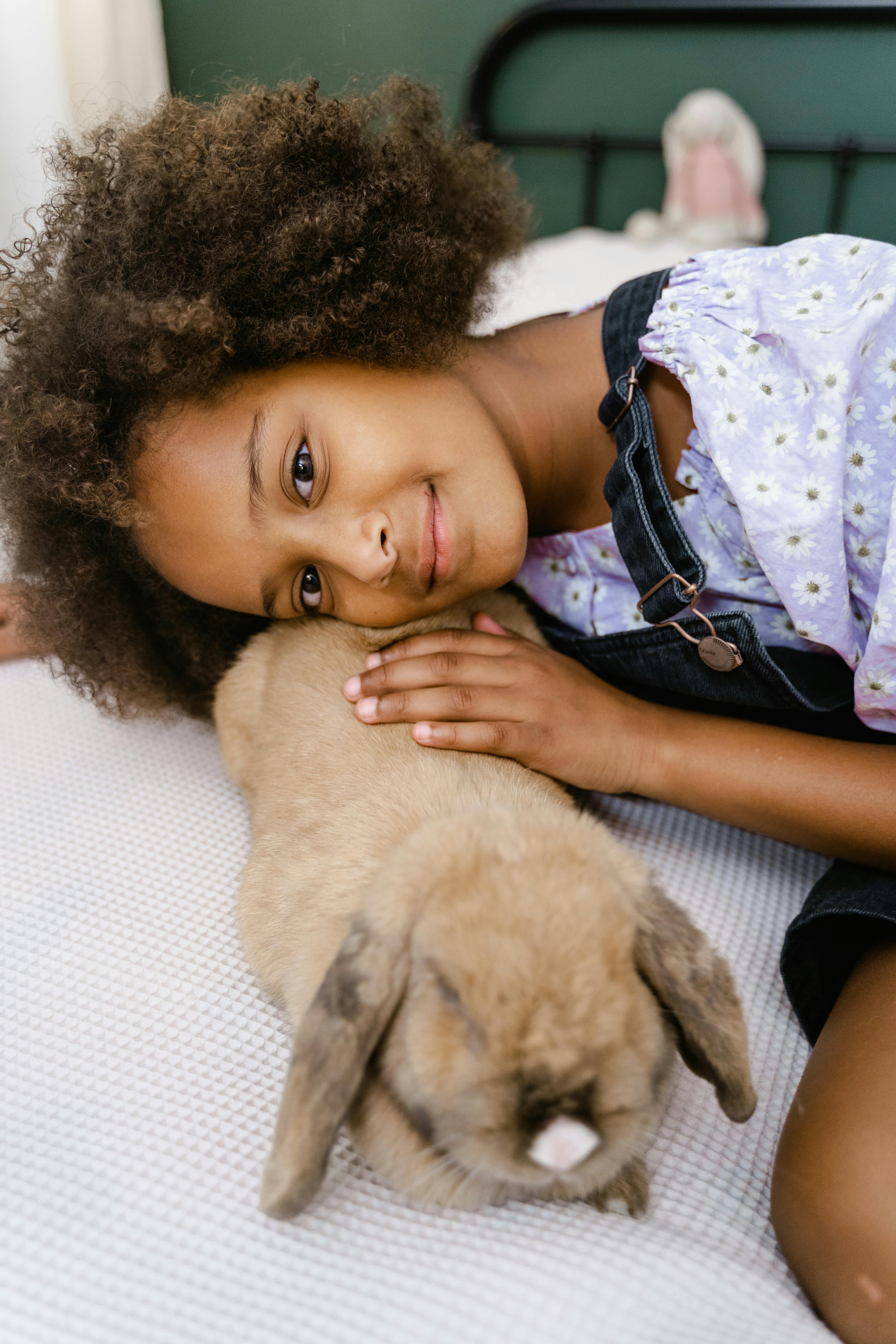 girl leaning on a rabbit