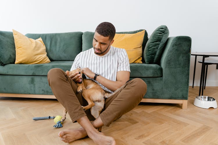 Man Holding A Dog