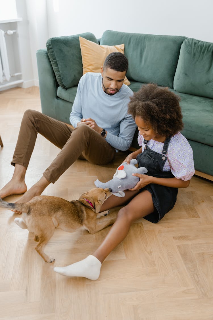 A Girl Playing With The Dog