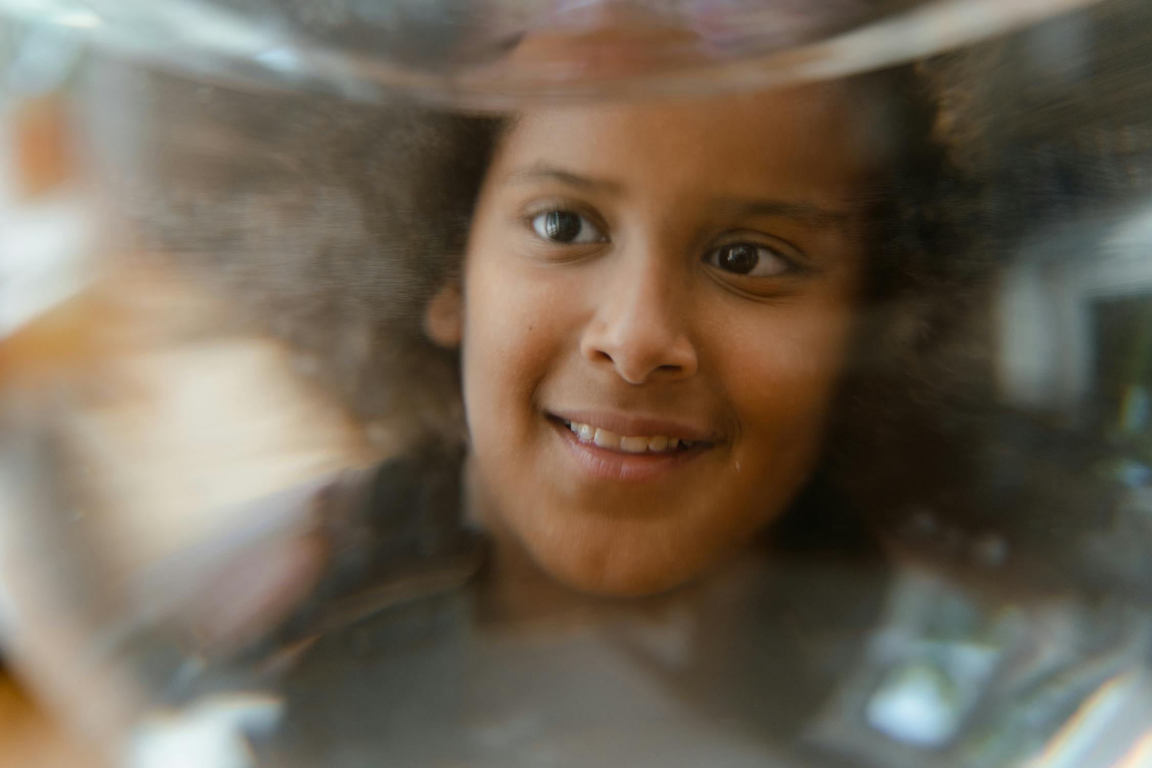 Kid Behind A Fish Bowl Free Stock Photo kid-behind-a-fish-bowl-free-stock-photo