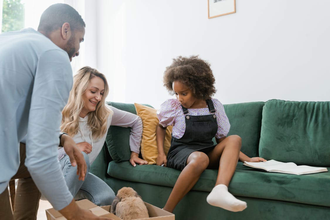 Parents Giving their Daughter a Dog 