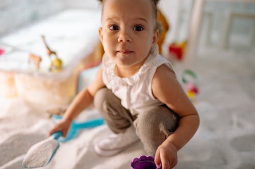 Shallow Focus Photo of a Cute Child Looking at Camera