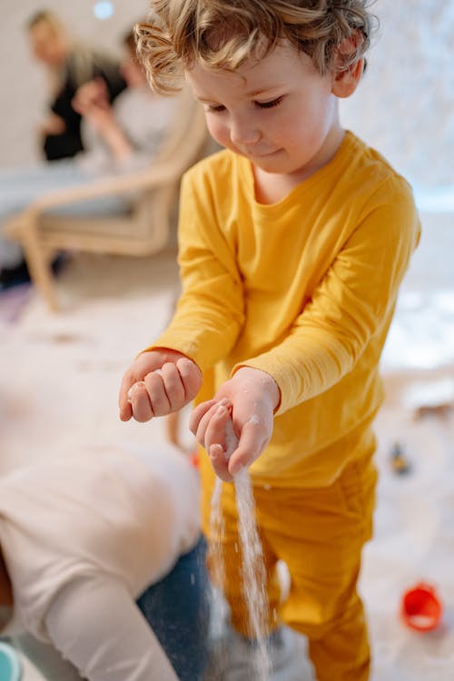 Child in Yellow Long Sleeve Shirt 