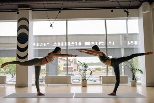 Free Two Women Doing Yoga Stock Photo