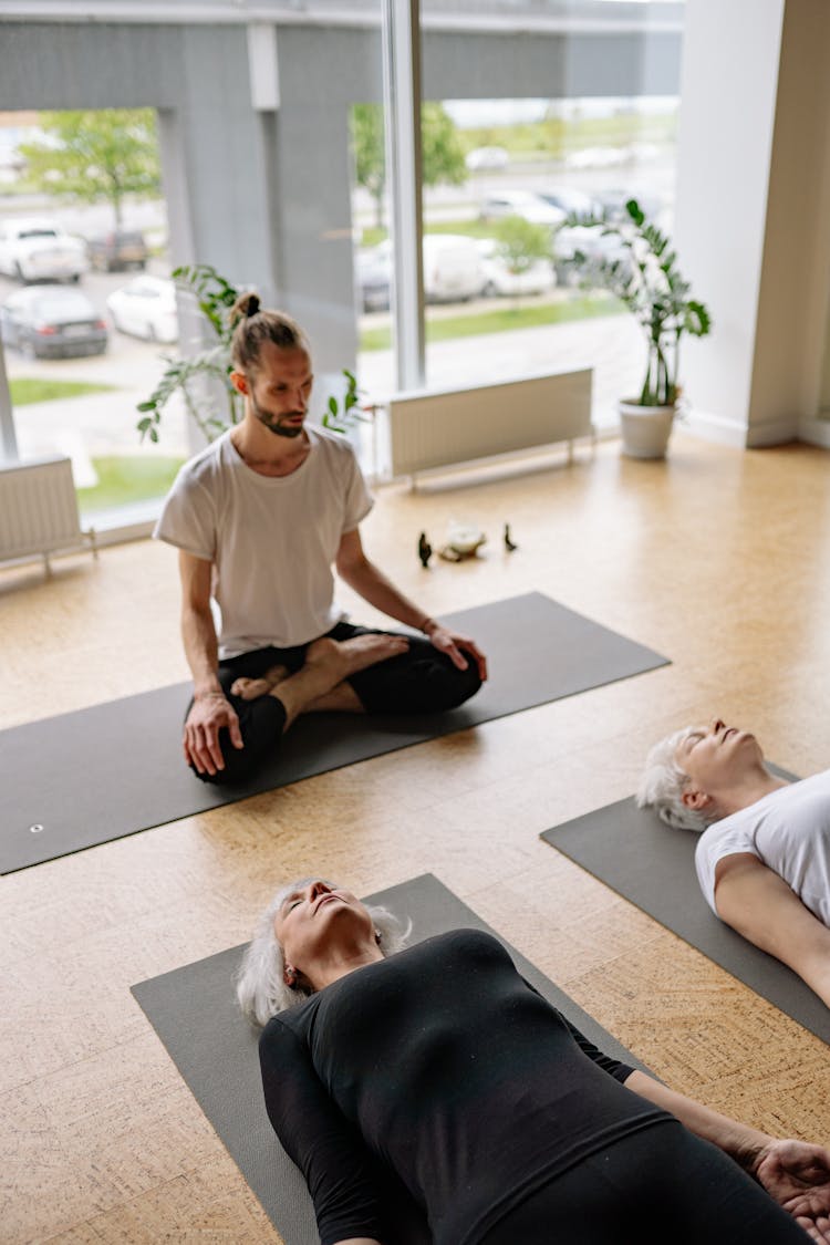 Women Meditating In A Yoga Class