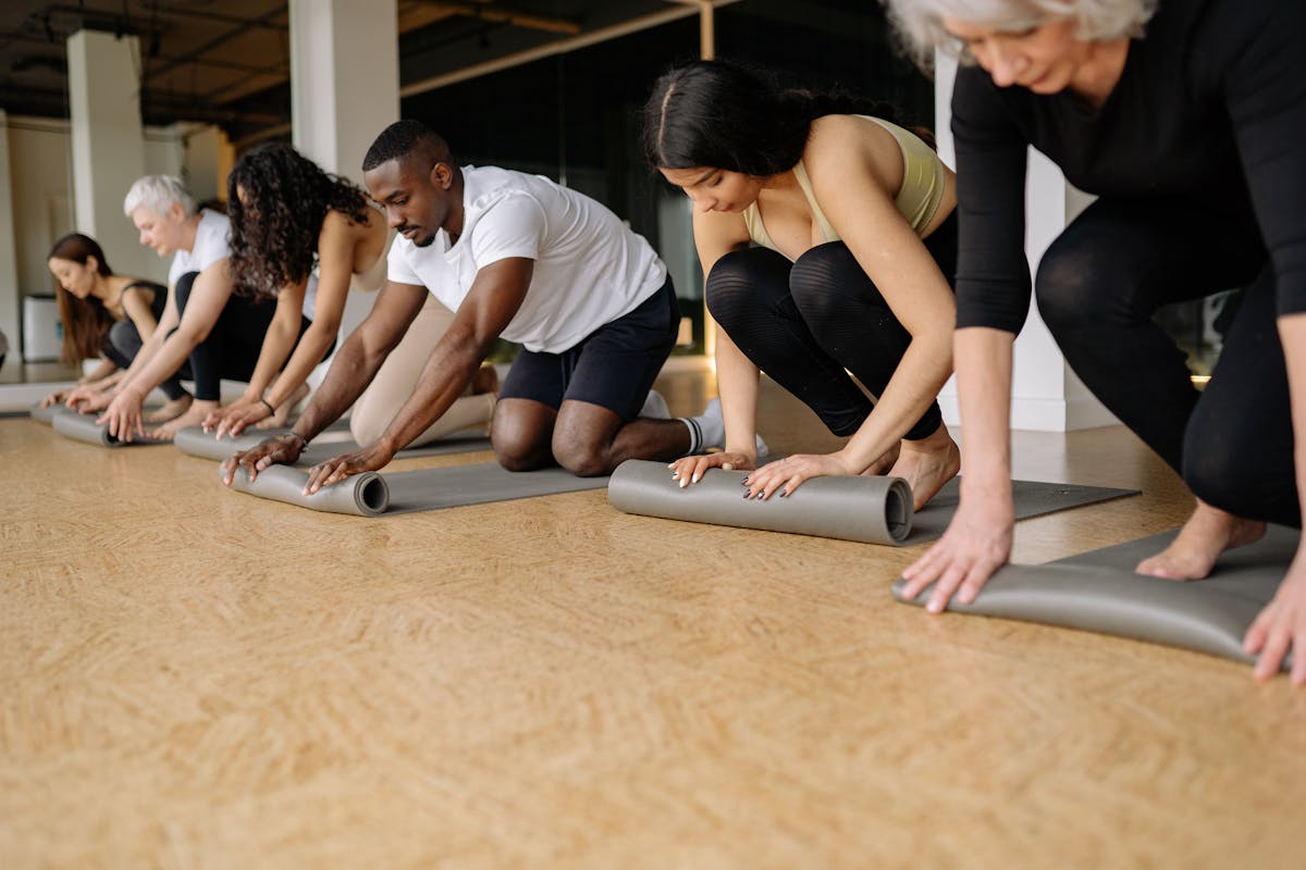 Senior woman doing wall push-ups in a bright living room