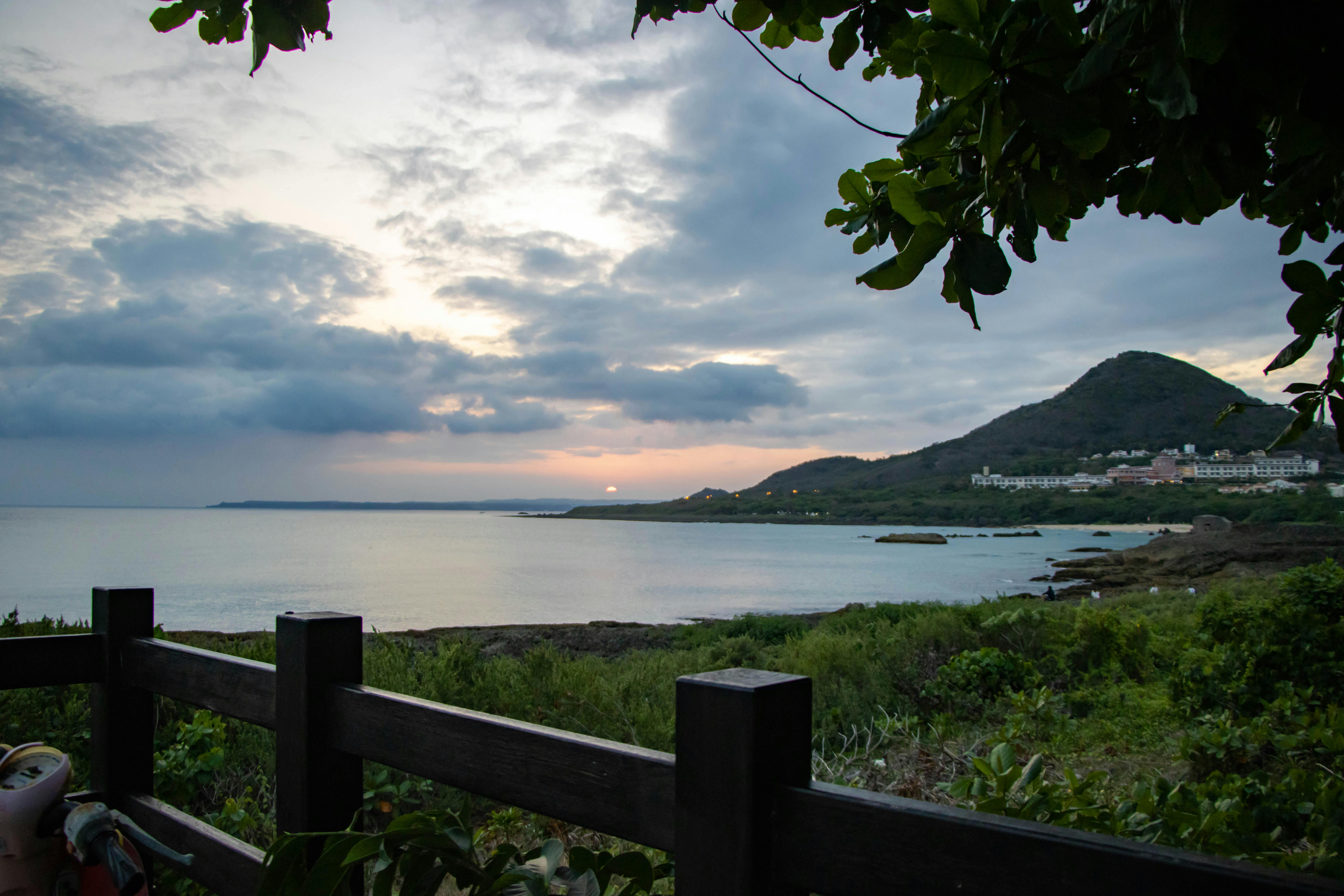 Older man smiling while walking outdoors with a friend