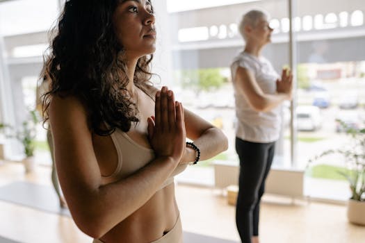 A diverse group in a yoga studio practicing mindfulness and relaxation.