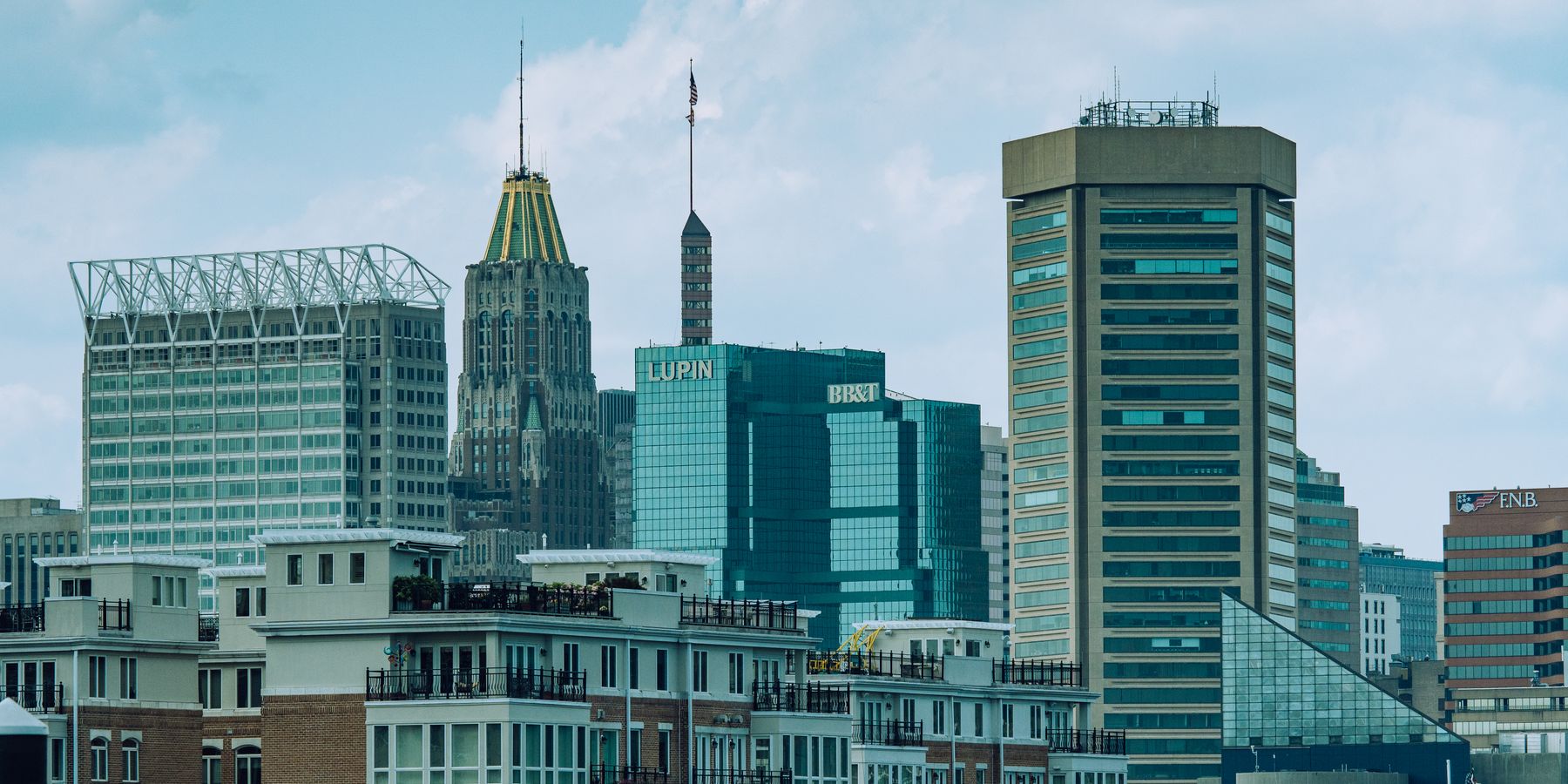 A vibrant view of Baltimore cityscape featuring iconic skyscrapers under a clear sky.