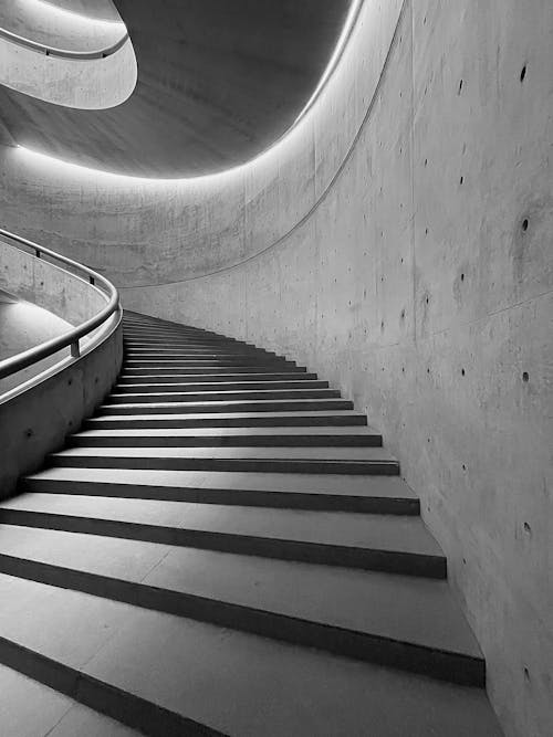 Grayscale Photo of Spiral Staircase