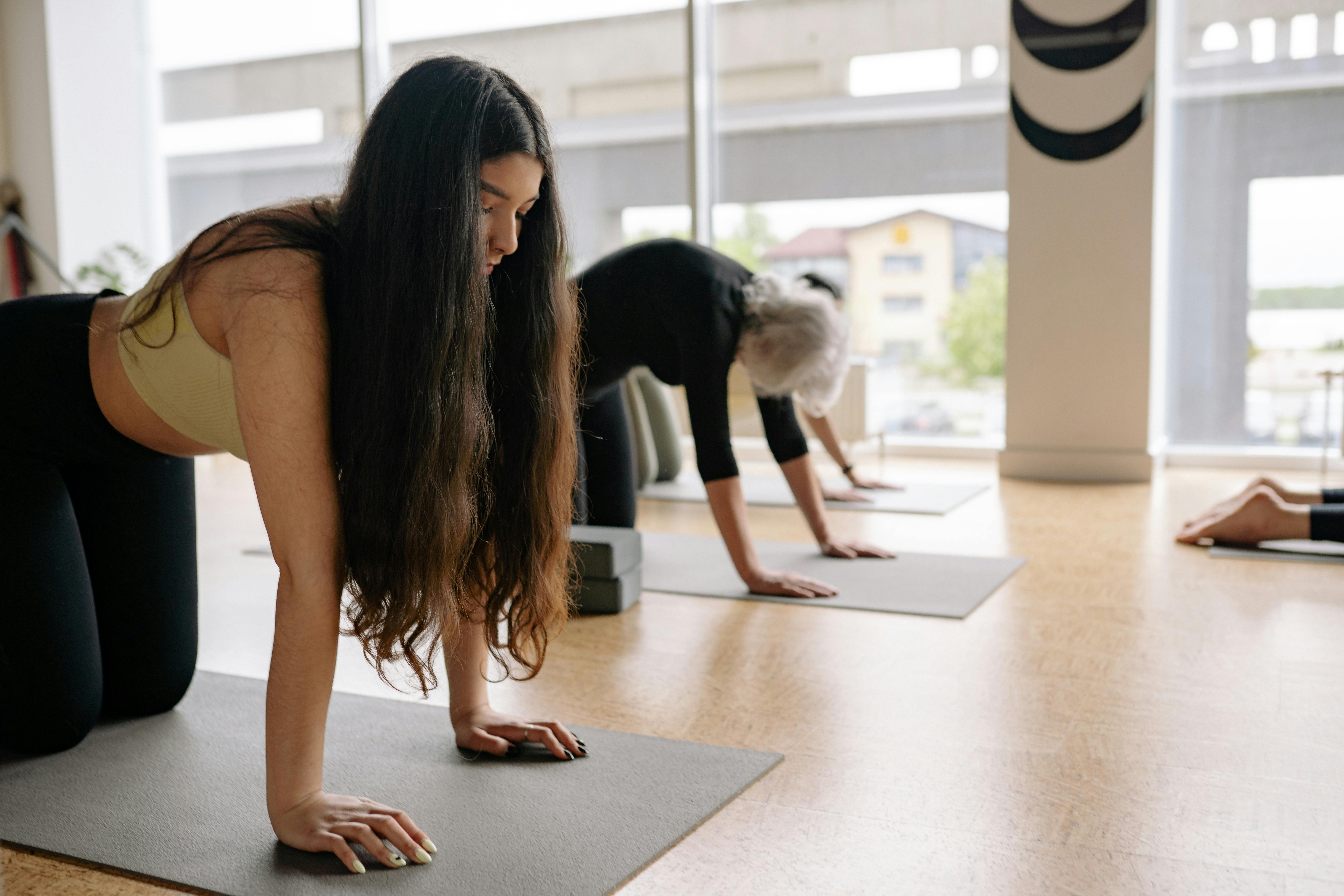 Woman with Curly Hair Doing Yoga · Free Stock Photo