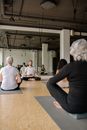 People Sitting on Floor Inside Room