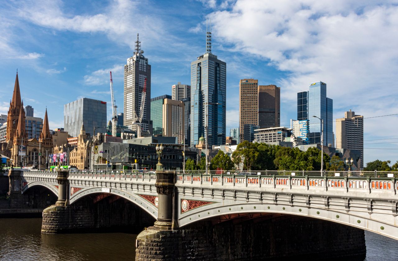 Stunning view of Melbourne's skyline featuring Princes Bridge and Yarra River.