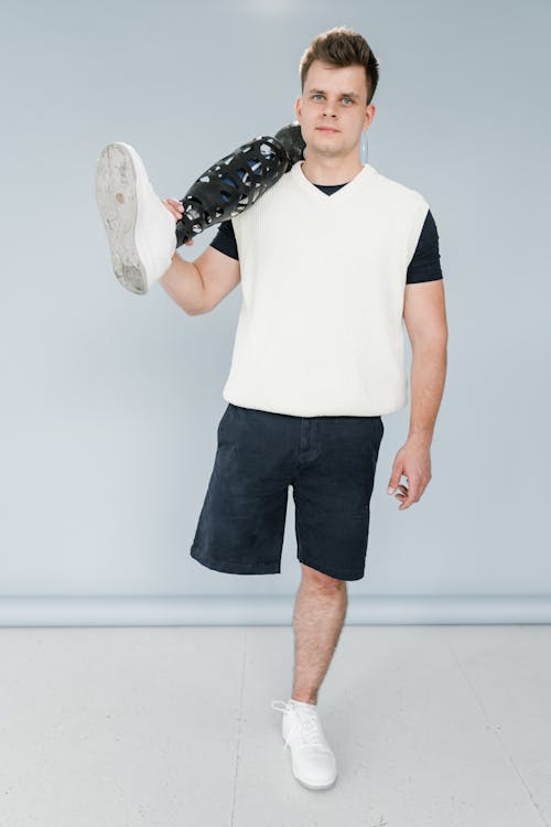 Man Holding a Prosthetic Leg