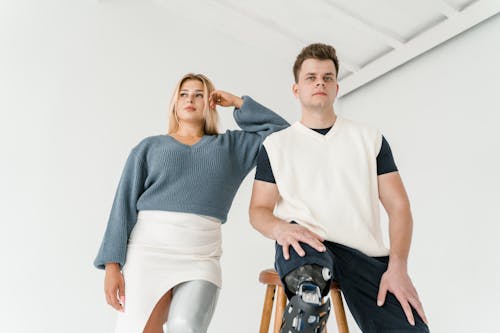 Man Sitting on Stool Beside a Woman