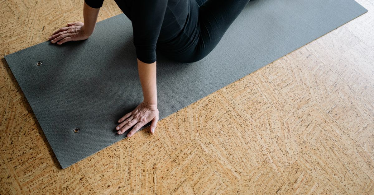 Hip mobility exercises for women over 40 - woman doing a hip stretch on the floor