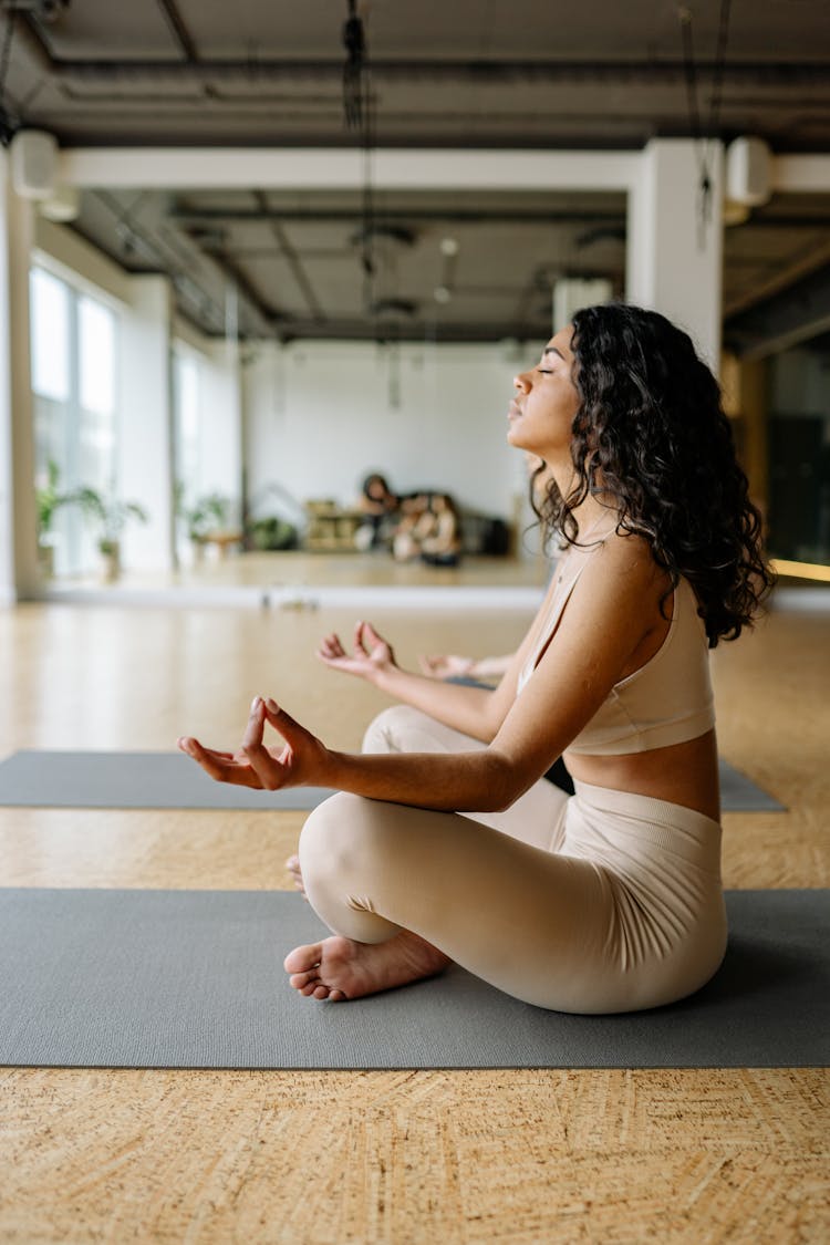 Young Woman Practising Yoga 