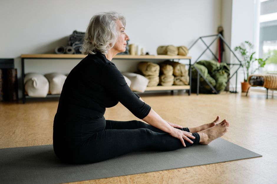 An older adult performing morning balance exercises with confidence An older adult performing morning balance exercises with confidence