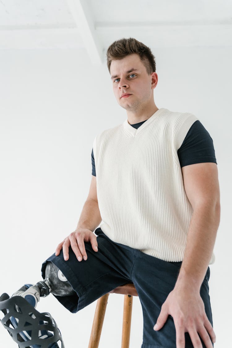 A Man Sitting On Stool