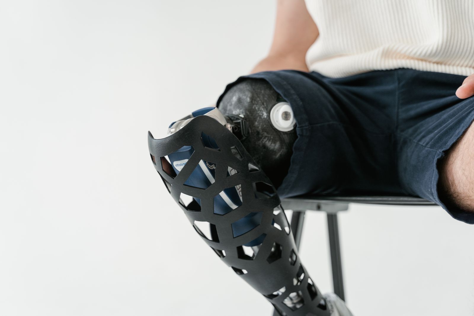 Person adjusting a fitted knee brace before outdoor activity
