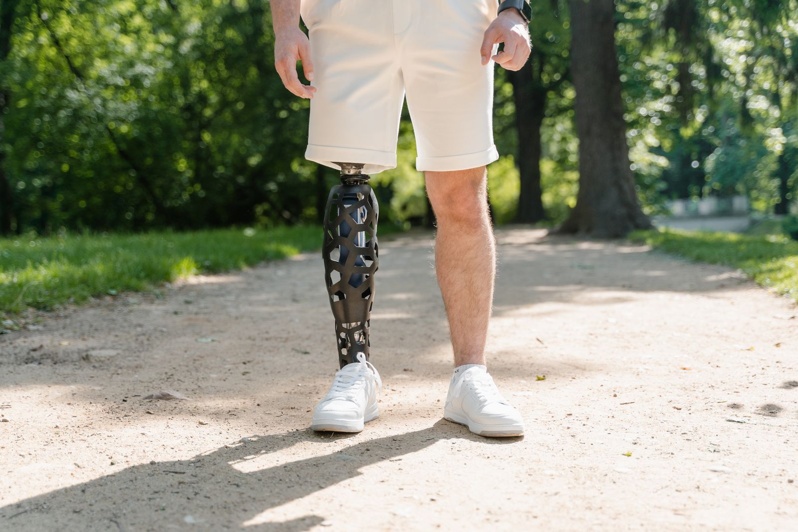Runner sitting outdoors while checking knee support after a sprain