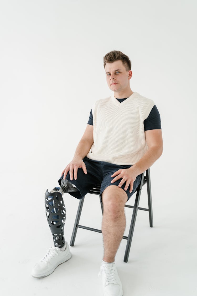 Photo Of Man Sitting On A Chair