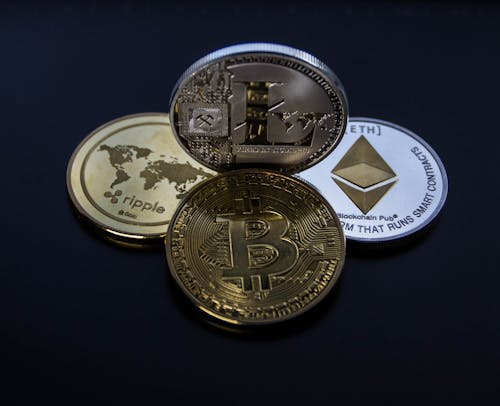 Free Four Assorted Cryptocurrency Coins Stock Photo
