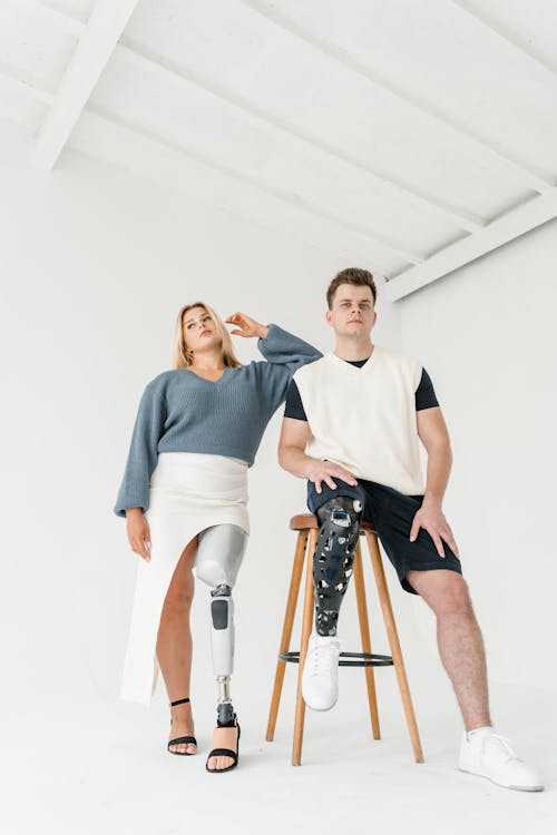 Low-Angle Shot of a Man and a Woman with Prosthetic Legs