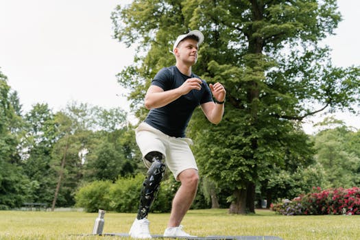 Man with prosthetic leg exercising in a park, promoting fitness and health.