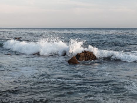 Ocean Waves Crashing on Brown Rock 